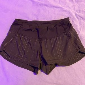 black lululemon shorts with sliver strips